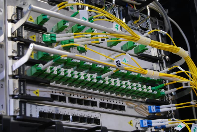 Fibre optic cables plugged into a network switch